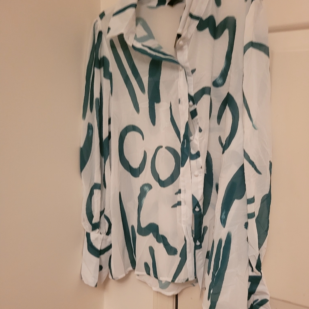 A green and creme blouse